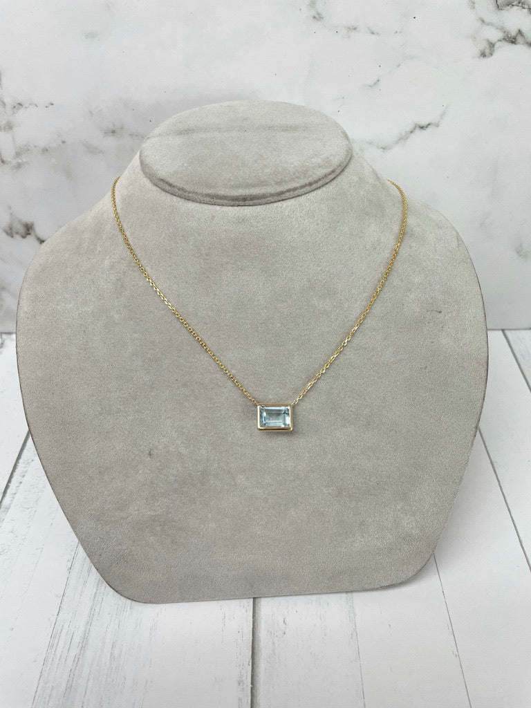 Emerald Cut Blue Topaz Bezel Pendant